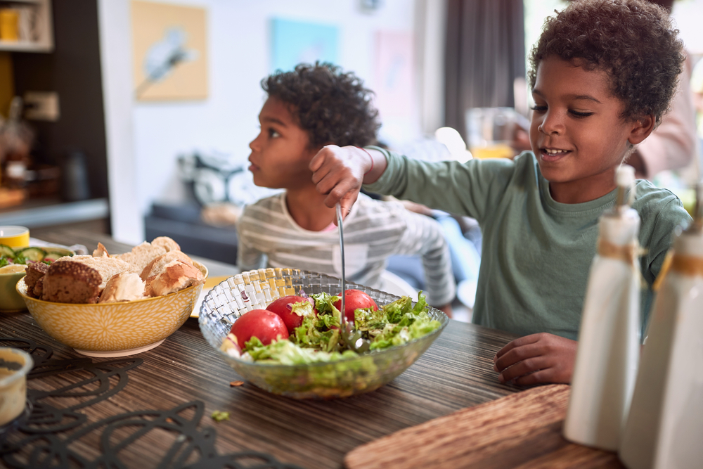 children at in the kitchen smiling together